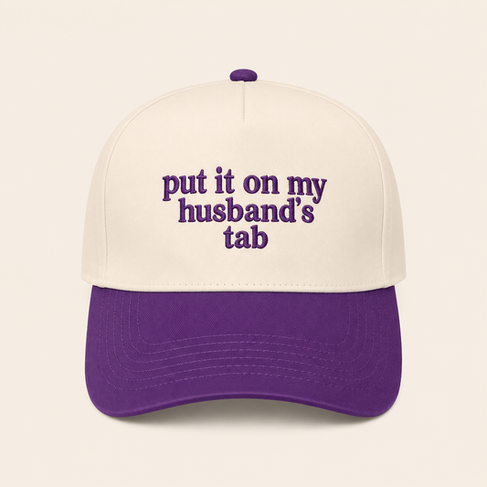 Put It on My Husband’s Tab Trucker Hat